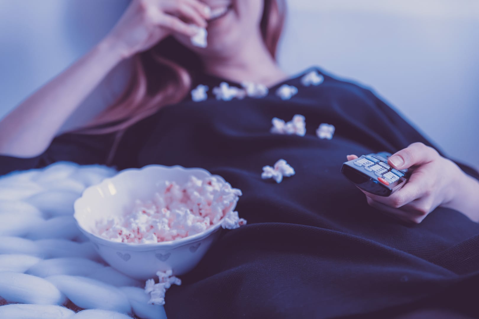 holding a remote control
